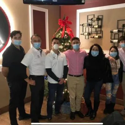 The cleaning company team, representing expert cleaning services, stands together.