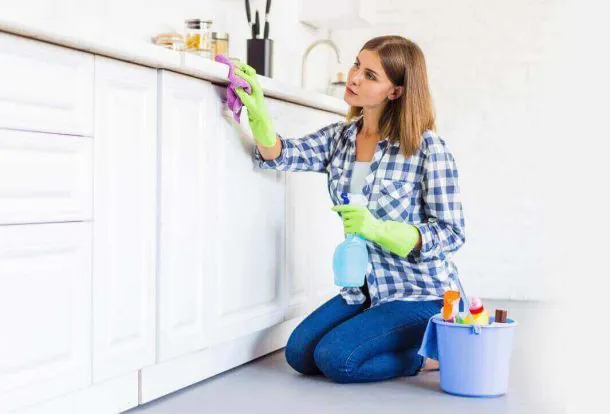 women cleaning the cabins of the house kitchen