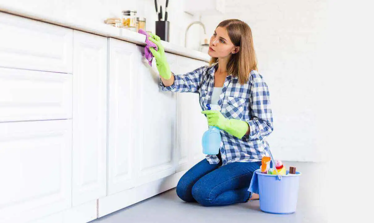 women cleaning the cabins of the house kitchen